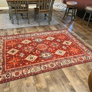 5’X7’ Rugsble brand washable rug. Small fray on one corner. Comes withh pad